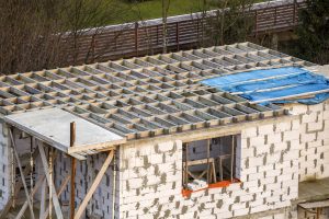 Building under construction. Roof beams frame and roofing